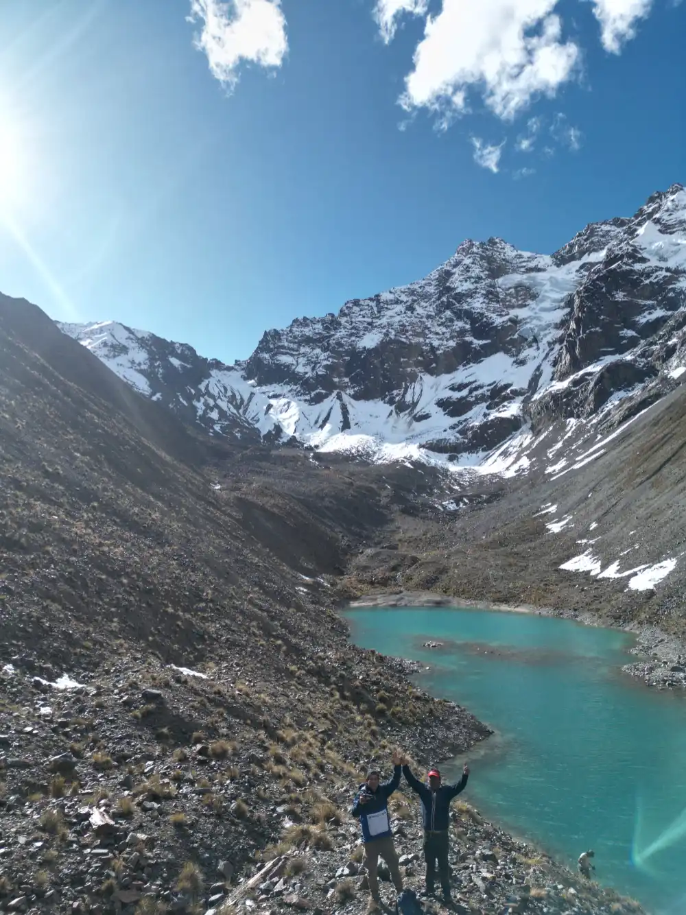 Turquoise waters of Inkachiriasqa Lake at the foot of Salkantay Snow Peak on a full day trek